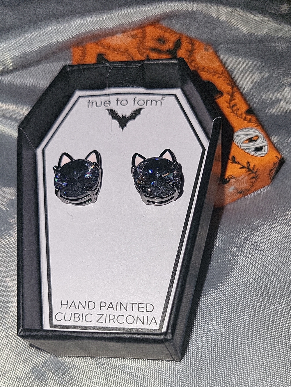 Cat gem stud earrings BNIB gunmetal